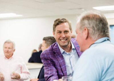 Man laughing with coworker