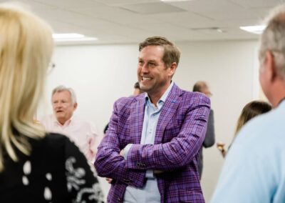 Man smiling in a group