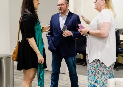 group of three people socializing
