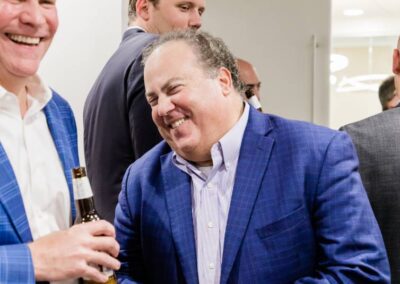 Image of two men laughing at NB summer social