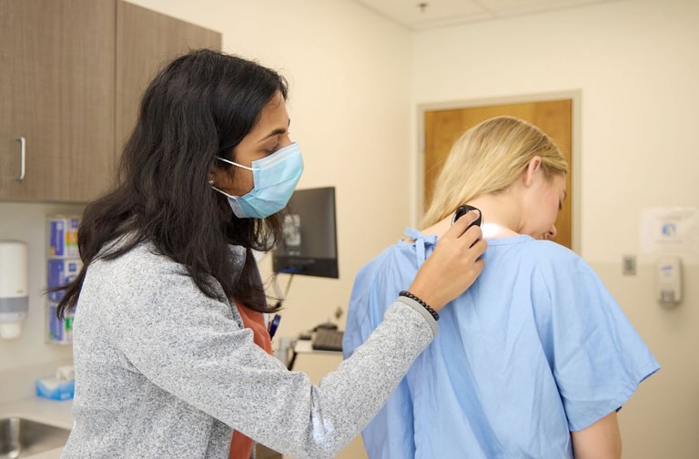 Image of a dermatologist screening