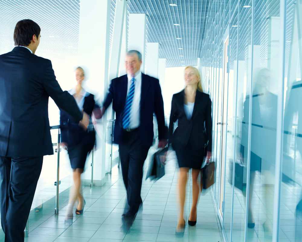 Image of business people walking down a hallway